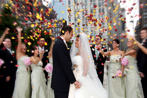 wedding photo by Bob and Dawn Davis Photography, happy couple, ceremony exit, wedding party, urban location